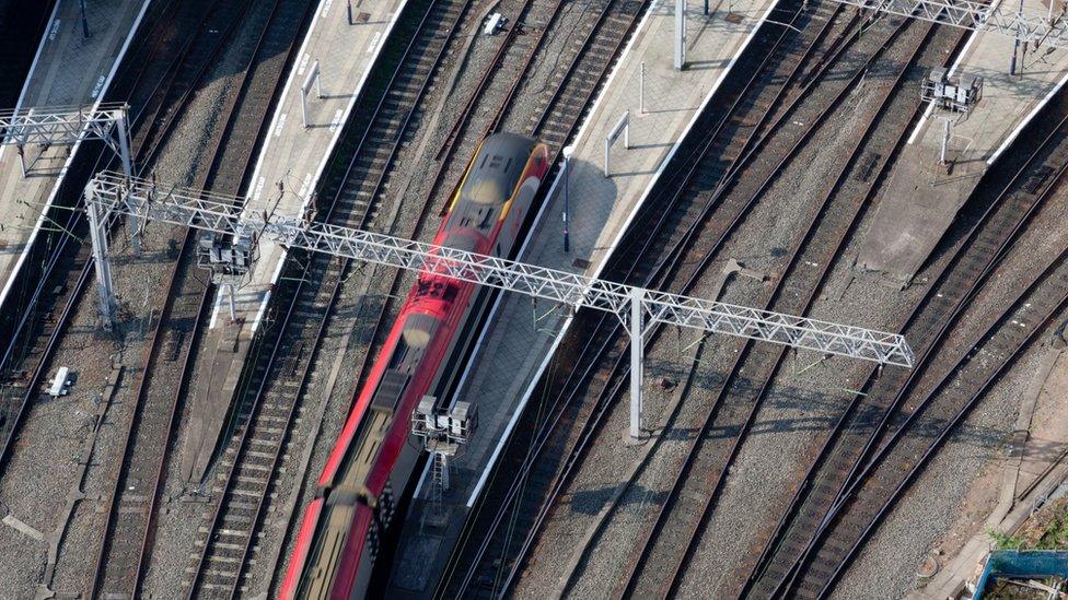 Express train arriving at a station - stock photo