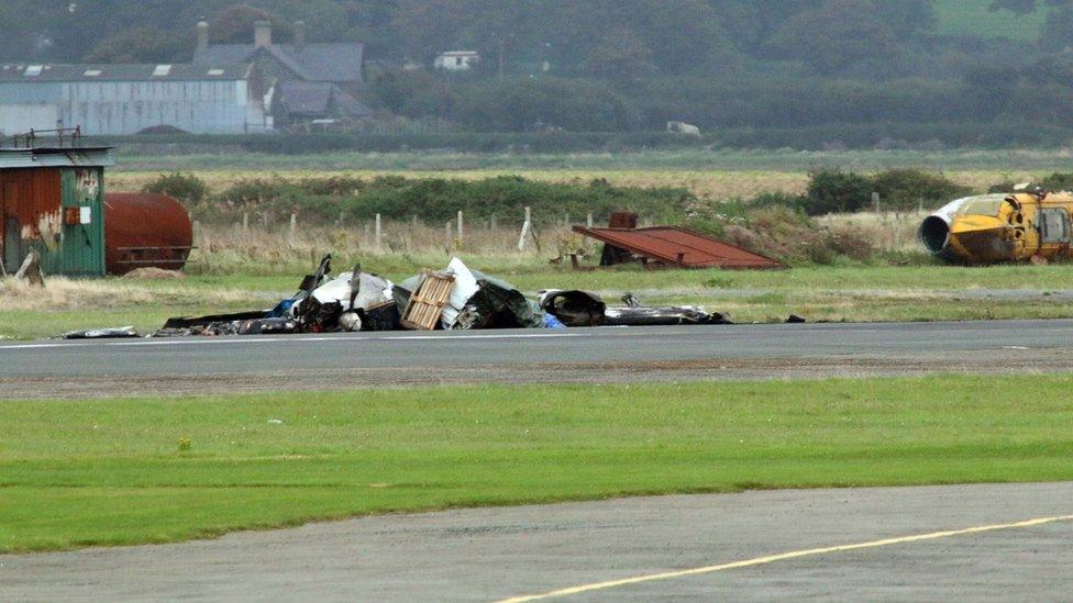 Wreckage of light aircraft on runway at Caernarfon Airport