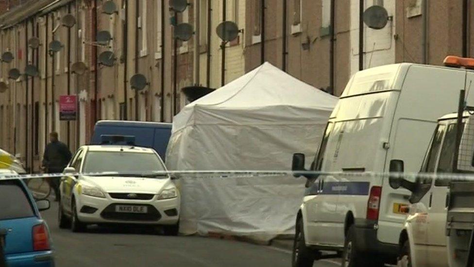 Police outside her home