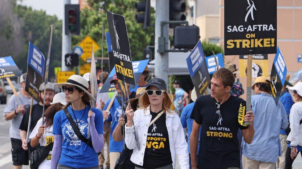 LOS ANGELES, CALIFORNIA - SEPTEMBER 28: Marg Helgenberger (C) joins the picket line outside Fox Studios on September 28, 2023 in Los Angeles, California. The WGA (Writers Guild of America) has reached a deal with Hollywood studios after 146 days on strike, ending the strike at midnight on September 27. Members of SAG-AFTRA and WGA (Writers Guild of America) walked out in their first joint strike against the studios since 1960, shutting down a majority of Hollywood productions. SAG-AFTRA has not reached a deal with the studios and has been on strike since July 14. (Photo by David Livingston/Getty Images)