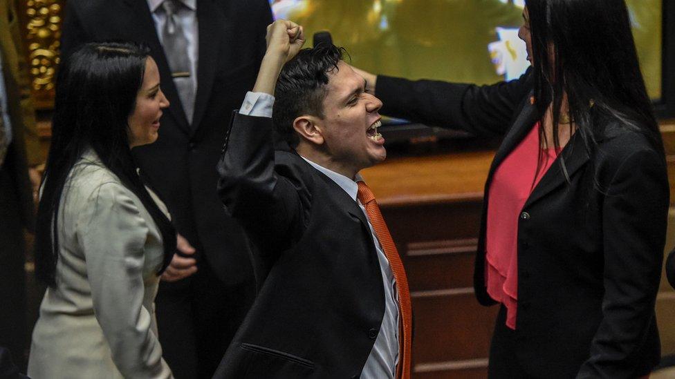 Rosmit Mantilla gestures after receiving his credentials as a legislator in Venezuela's National Assembly in November 2016