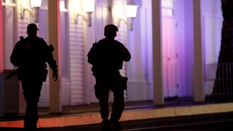 armed police officers walking outside casino on Las Vegas Strip