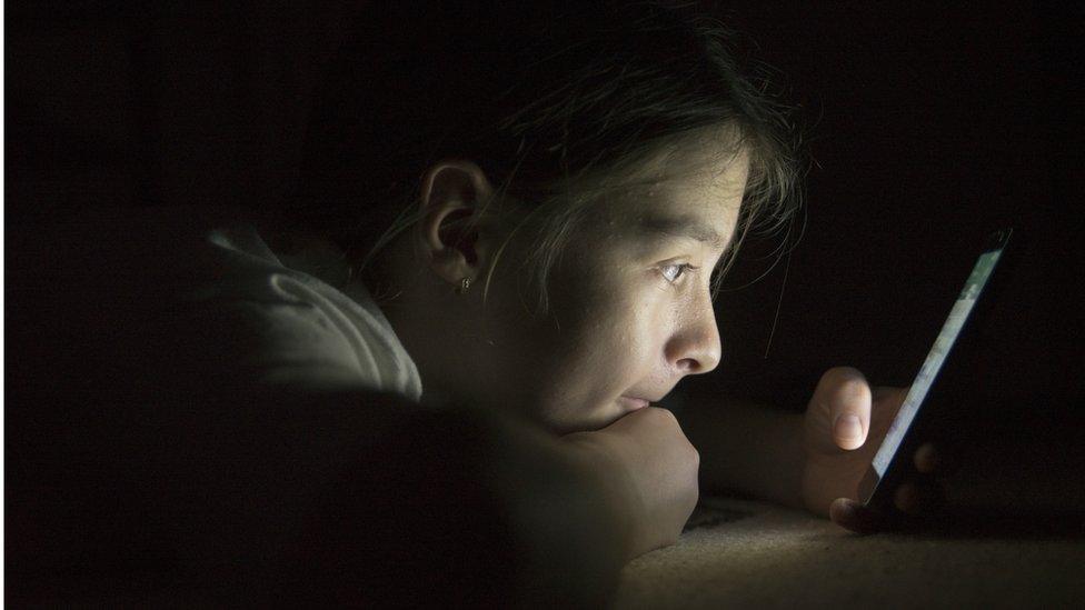 Teenage girl using mobile phone