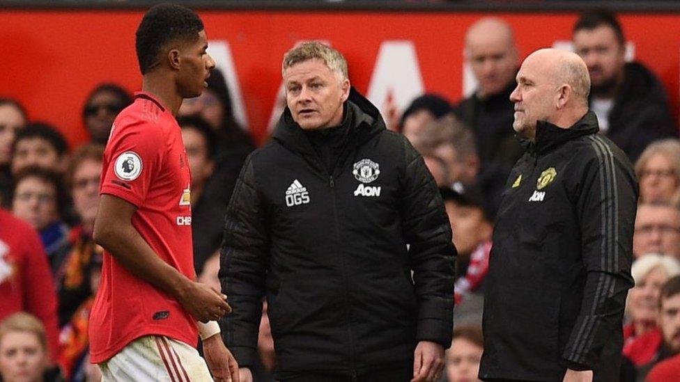 Marcus Rashford and Mike Phelan.