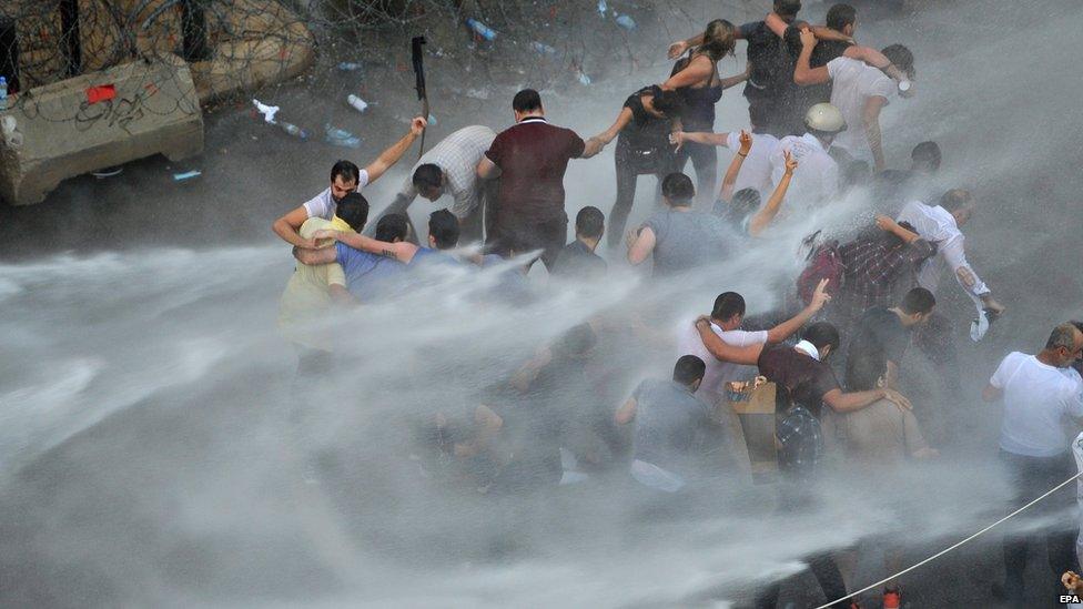 Security forces fire water canon at protesters in Beirut, 22 August 2015
