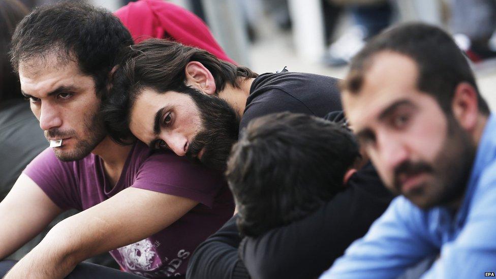 Relatives wait outside a morgue in Ankara, 11 October