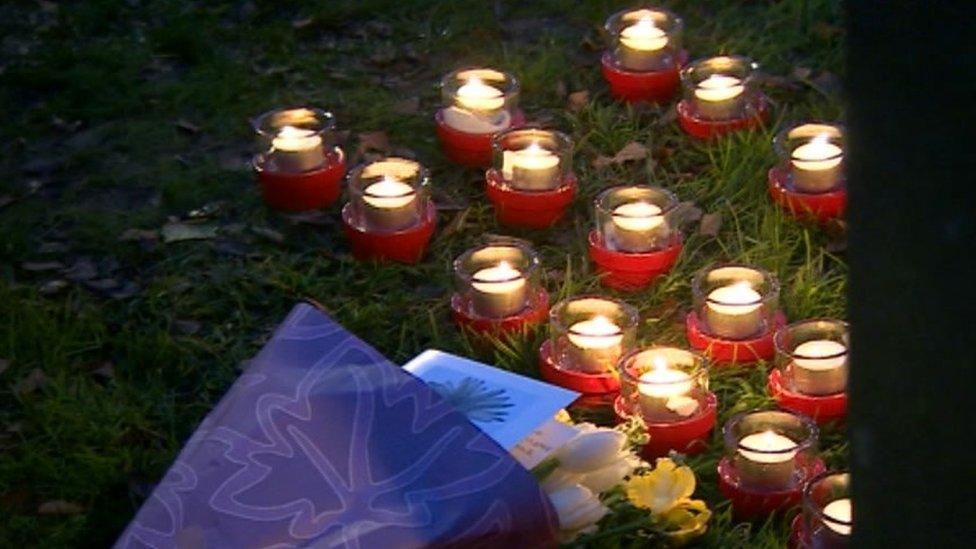 Candles by the current memorial