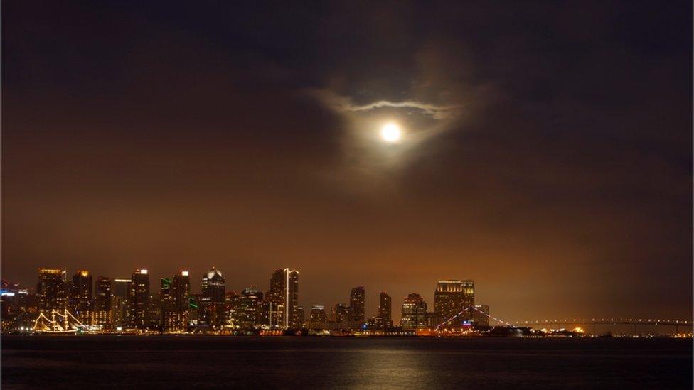 On the west coast of the USA, it was a cloudy night but spotters in San Diego got a peak of the super moon through the clouds