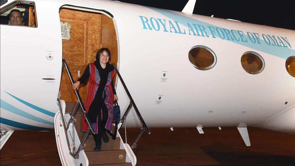 This photo made available by Oman News Agency, shows retired Iranian-Canadian professor Homa Hoodfar arriving in Muscat airport, Oman