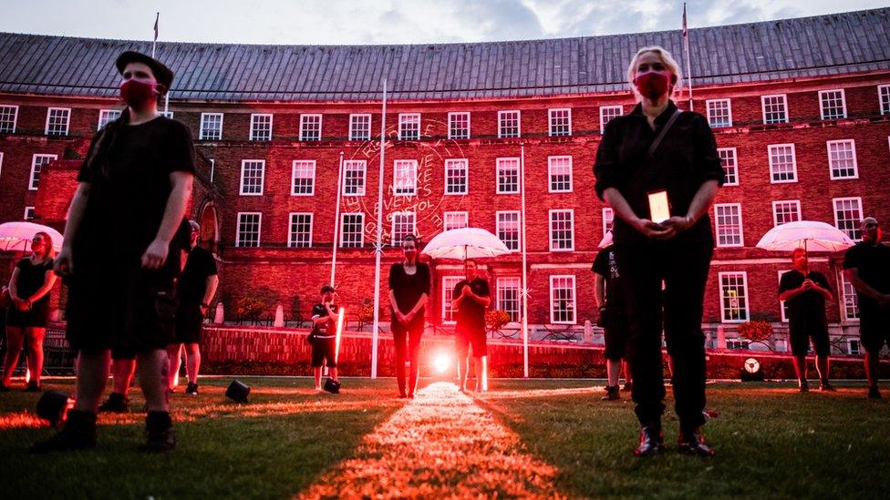 Events workers stood together in silent protest in front of Bristol's City Council building