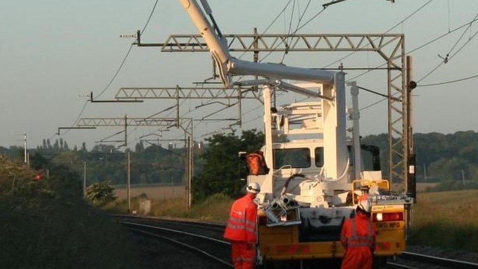 Rail engineers working on overhead lines