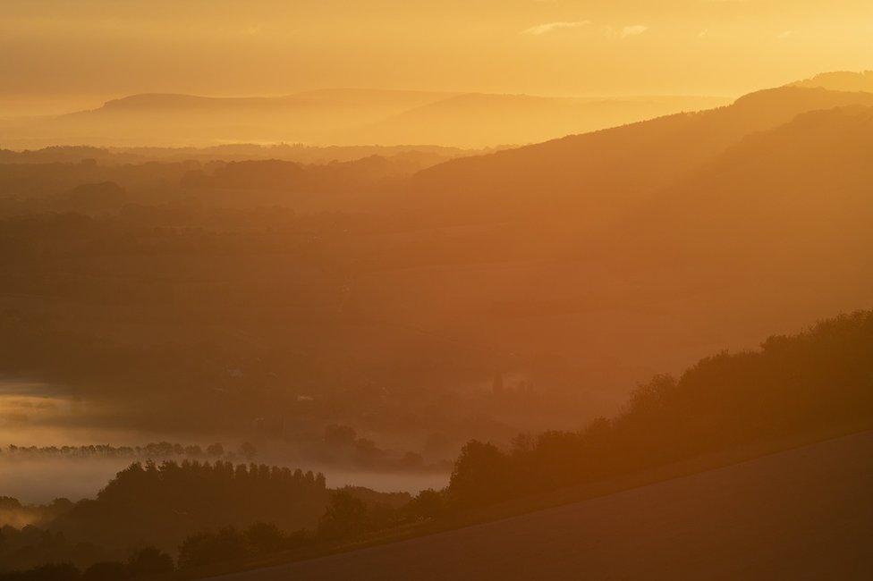 The sun rises over the South Downs National Park