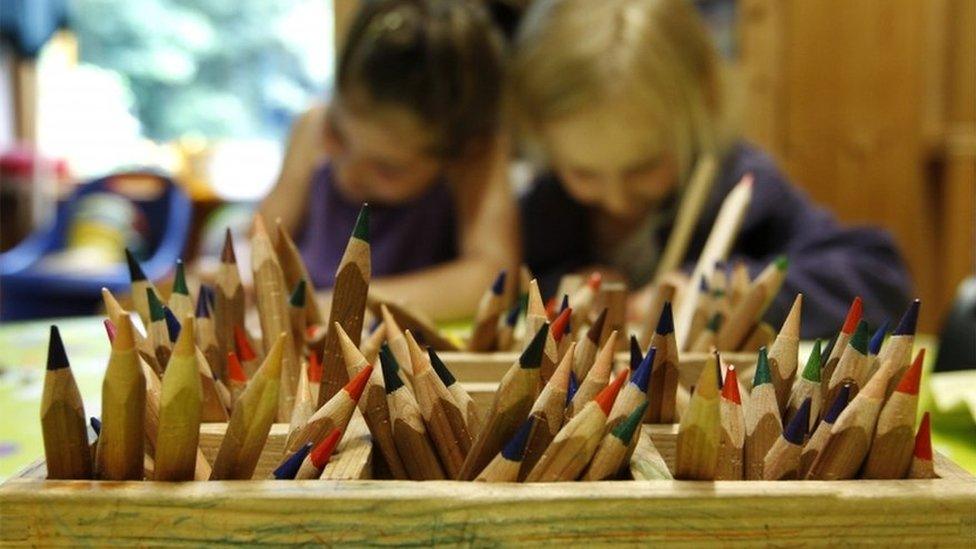 Children concentrating in a nursery