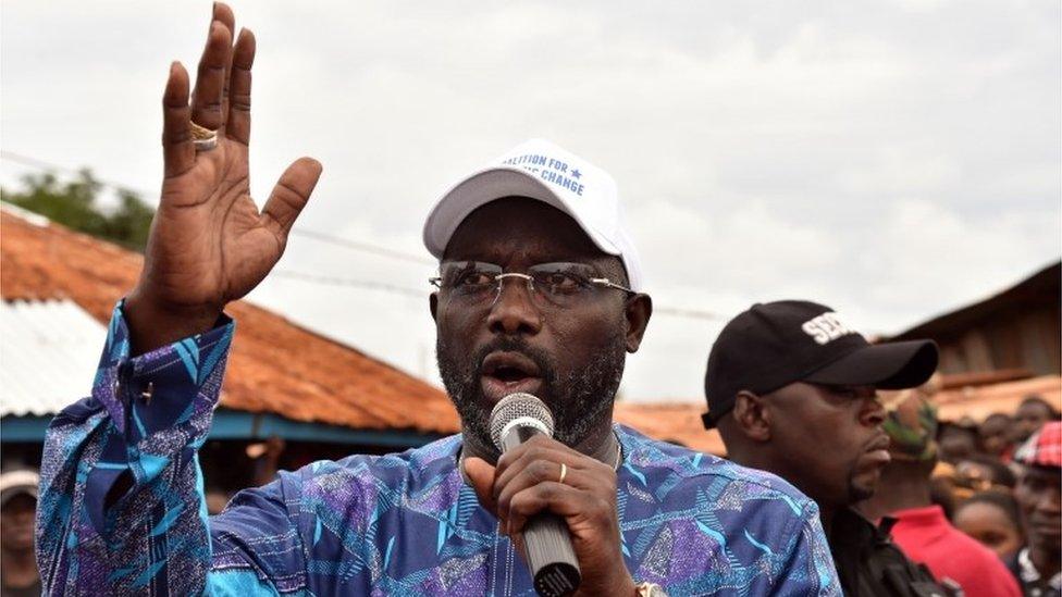 George Weah, addresses supporters during a campaign rally in Monrovia on October 8, 2017