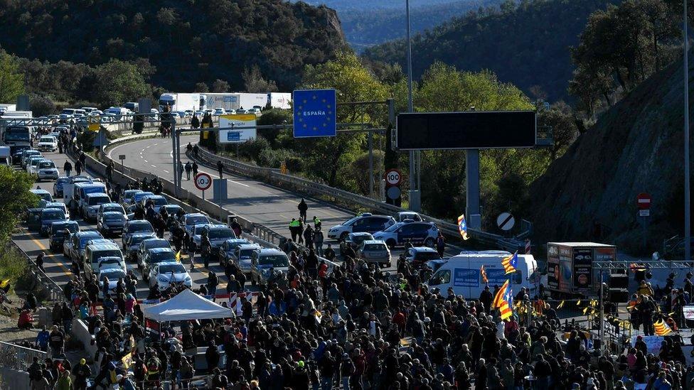 Protesters block the AP-7 motorway at the Spanish-French border in La Jonquera, northern Spain, 11 November 2019