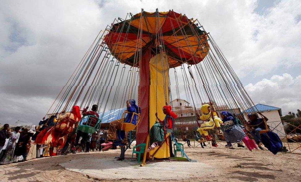Somali children play after attending Eid al-Fitr prayers to mark the end of the fasting month of Ramadan in Somalia"s capital Mogadishu, July 6, 2016