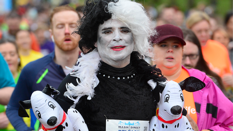 Runner dressed as Cruella de Vil from 101 Dalmatians