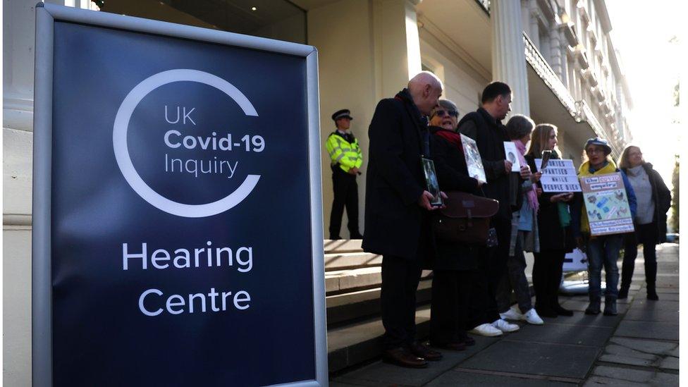 Bereaved relatives protesting outside the Covid inquiry in London