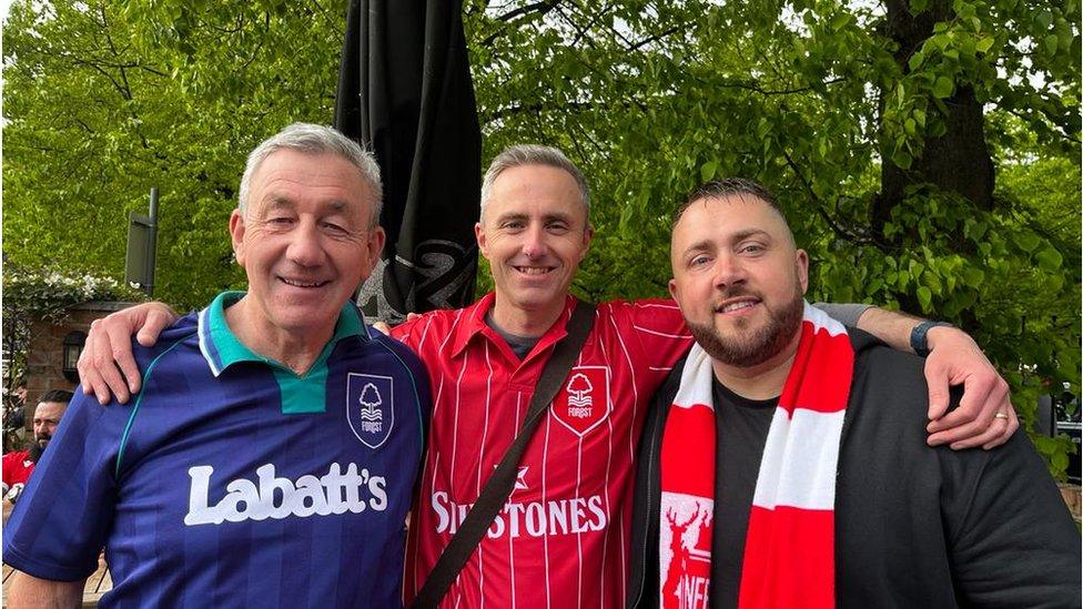 Neil (centre), his dad and a friend