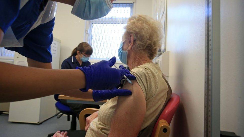 Woman being vaccinated