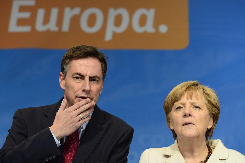 German MEP David McAllister with Chancellor Angela Merkel, file pic