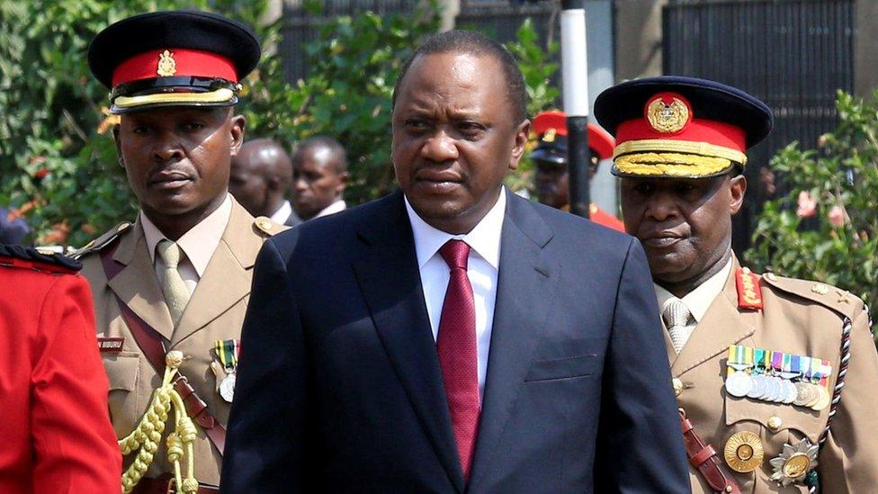 Kenya's President Uhuru Kenyatta inspects the honour guard before the opening of the 12th Parliament outside the National Assembly Chamber in Nairobi, 12 September 2017