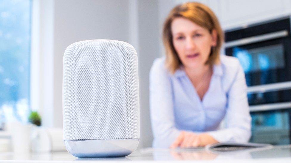 Woman using AI speaker