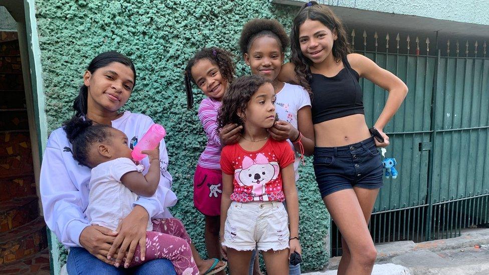 Joyce - Guilherme's neighbour - surrounded by her children