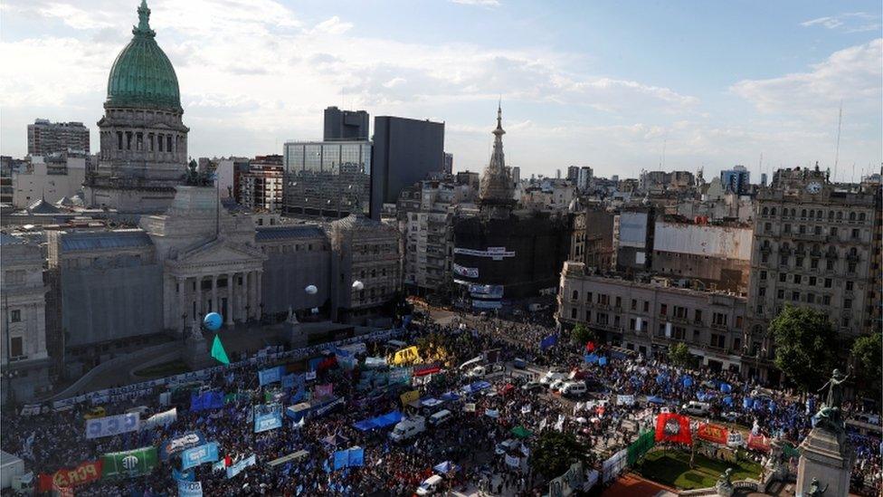 Demonstrators outside Argentina's National Congress in November during debates about a tax on the wealthy