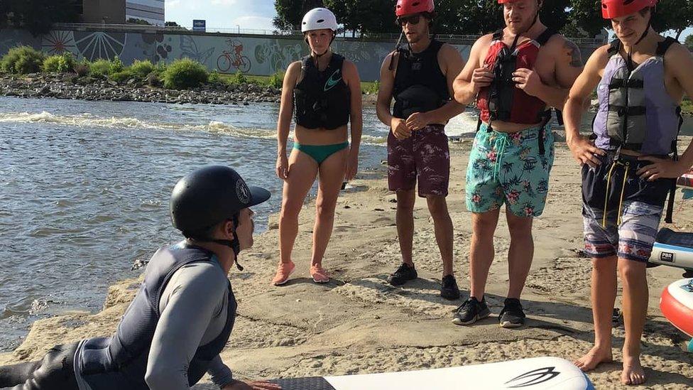 Jake Brown teaching four new surfers