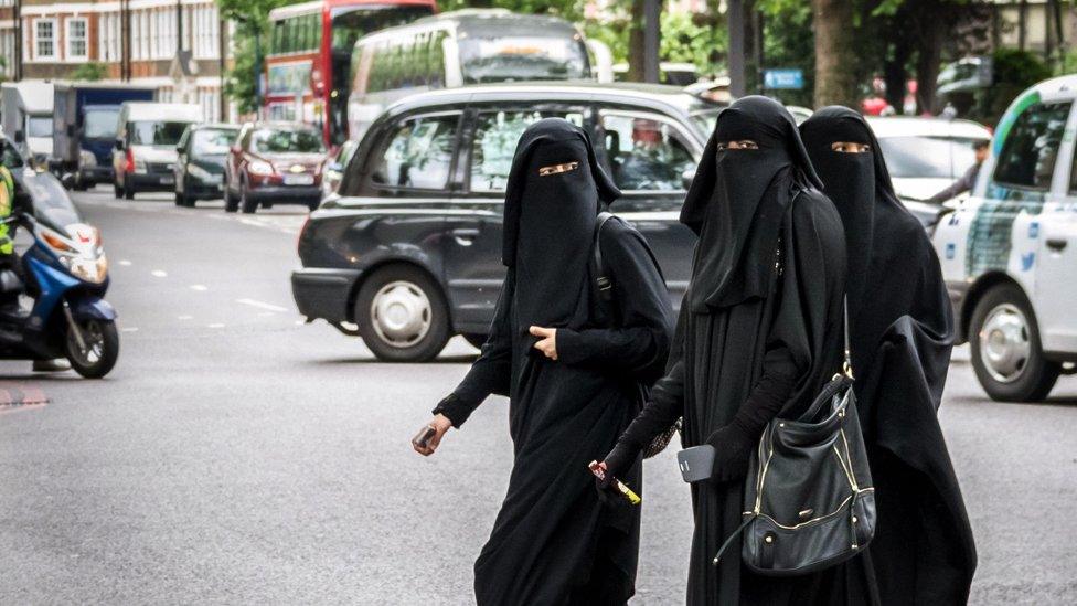 Muslim women cross a road in west London, File photo - May 2014