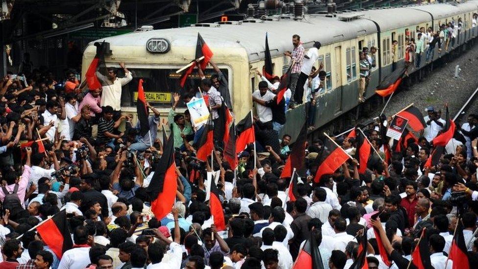 Members of various Tamil organisation that support jallikattu stop a train during a protest to lift the ban permanently (20 January 2017)