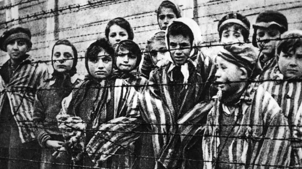 A group of child survivors at Auschwitz-Birkenau on the day of the camp’s liberation by the Red Army, 27 January 1945