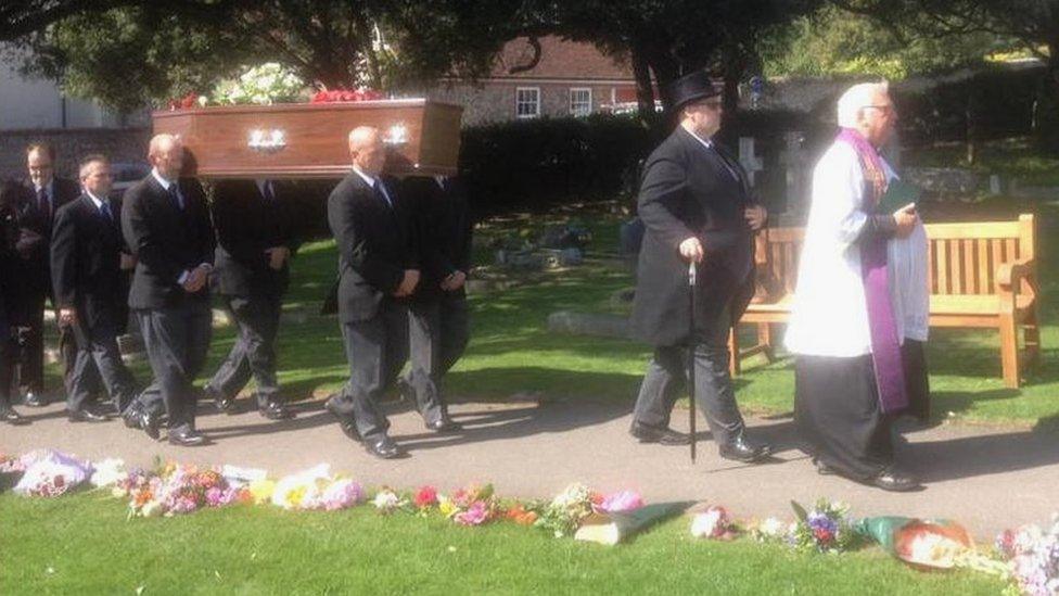 Maurice Abrahams's coffin is carried into St Margaret's Church