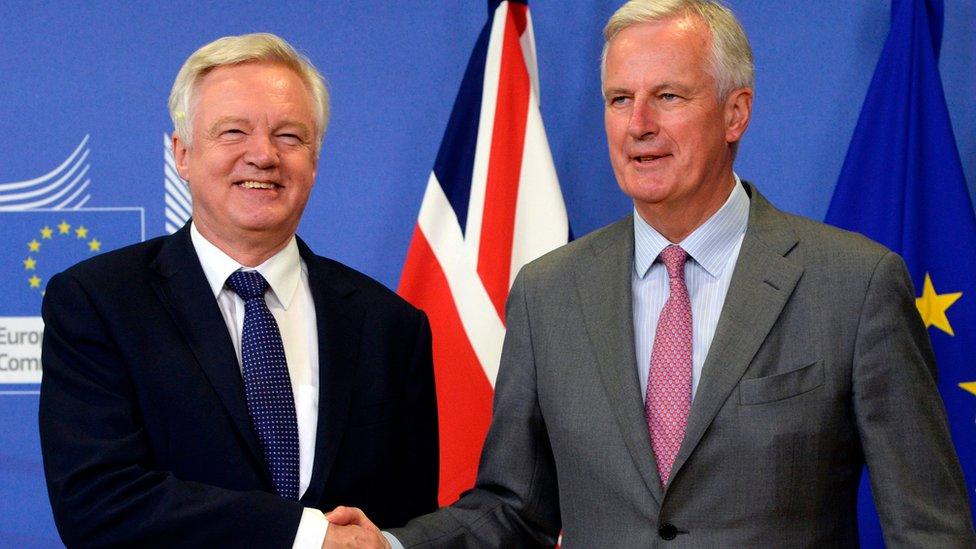 British Secretary of State for Exiting the European Union (Brexit Minister) David Davis (L) shakes hands with European Union Chief Negotiator in charge of Brexit negotiations with Britain Michel Barnier