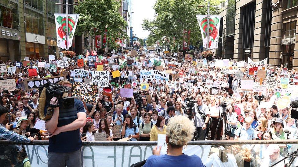 A crowd of student protesters fill up a city square in Melbourne