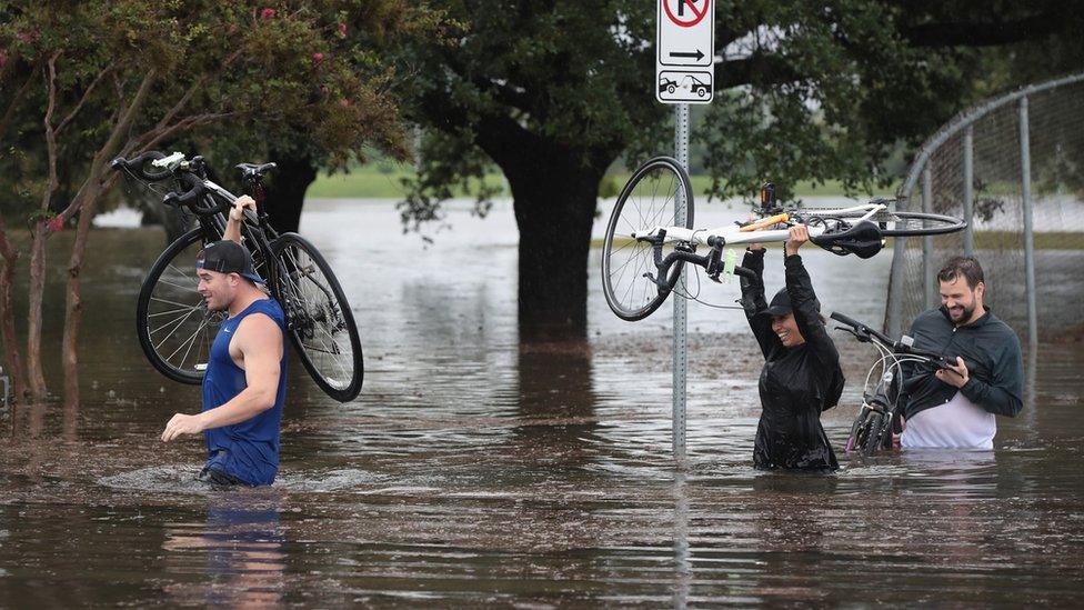 People have been forced to wade through water as it quickly filled the streets.