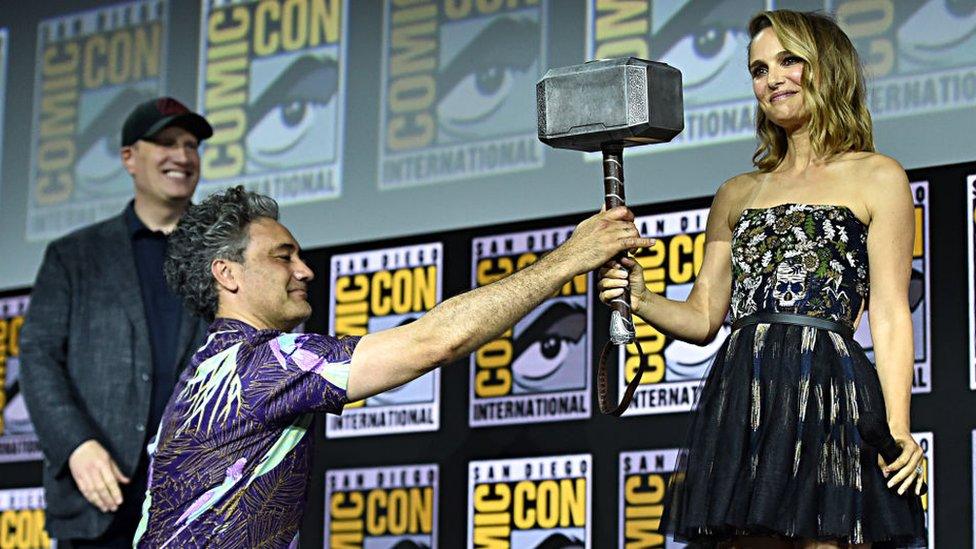 Natalie-Portman-receiving-Thor-Hammer.