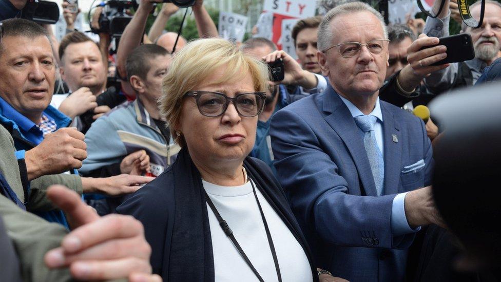 Supreme Court President Malgorzata Gersdorf walks to the Supreme Court building, next to supporters, in Warsaw, Poland July 4, 2018.