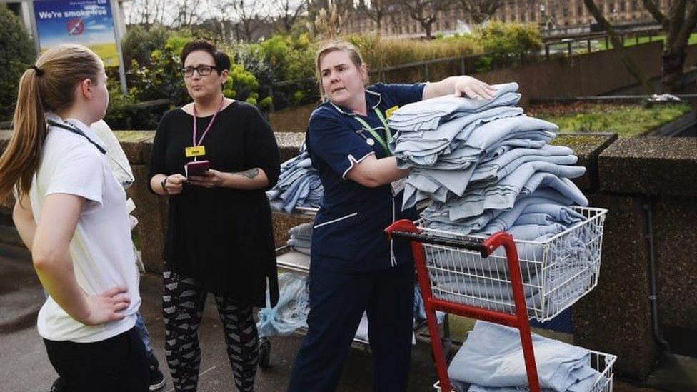 Nurses from St Thomas's Hospital pile up blankets for the injured.