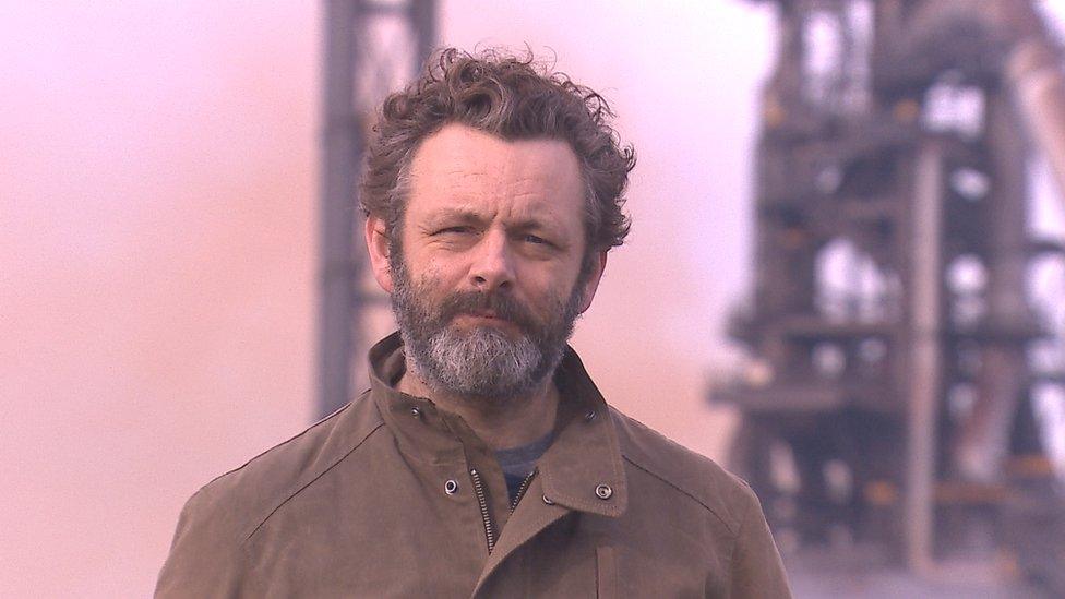 Michael Sheen with Port Talbot steelworks in the background