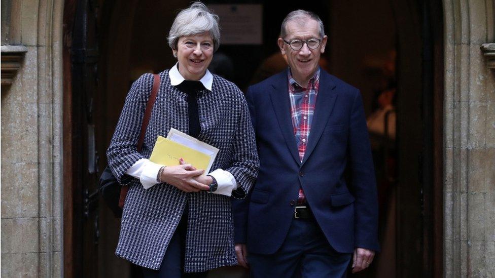 Theresa May and her husband Philip leave church on Sunday morning