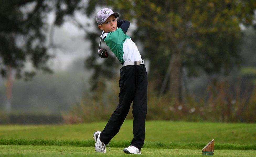 Zachary Blayney swinging a golf club