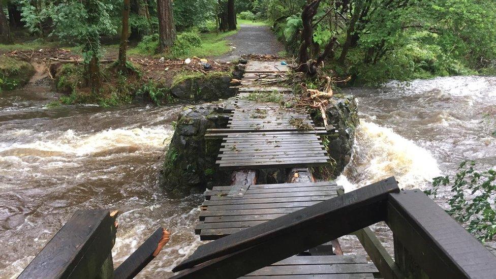 An old bridge in Tollymore Forest Park which has been destroyed by flooding from the Shimna River in NI