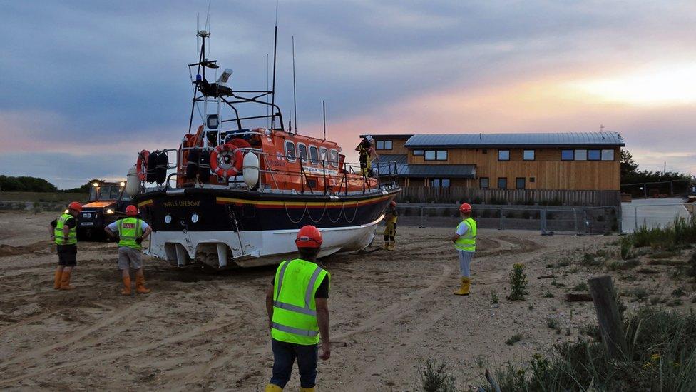 Mersey lifeboat being taken in at dusk