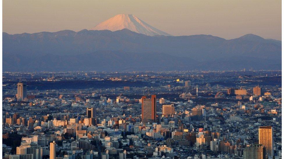 Picture shows Mount Fuji in the far distance, with Tokyo in the foreground. 1 January 2011.