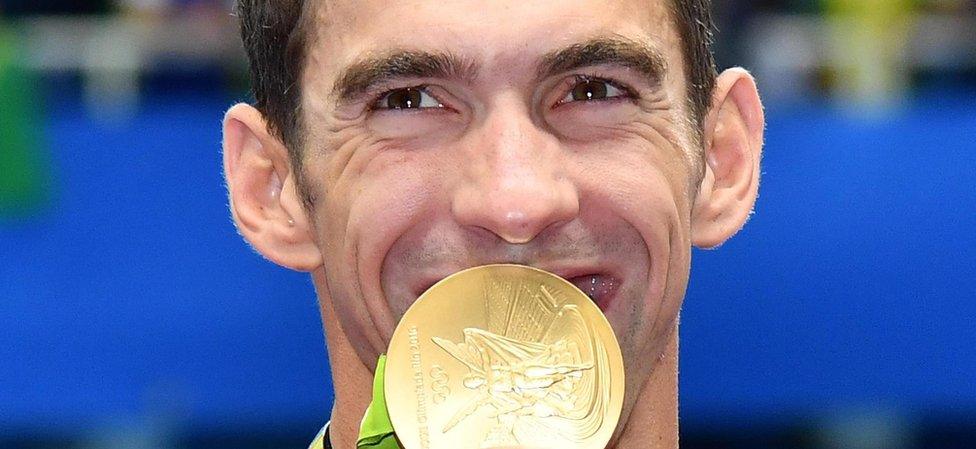 Michael Phelps with a gold medal at the Olympics Aquatics Stadium