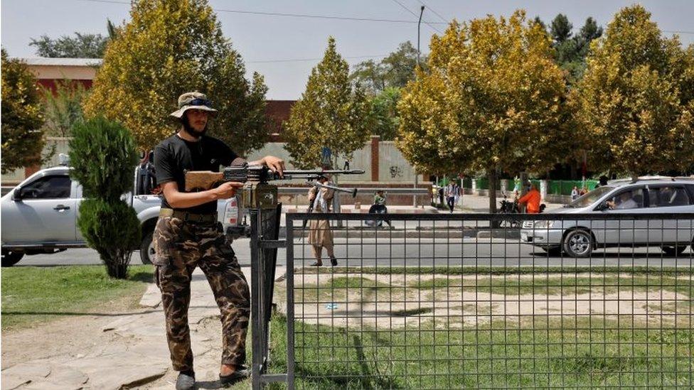 A Taliban fighter stands guard after a blast in front of the Russian embassy in Kabul, Afghanistan, September 5, 2022.