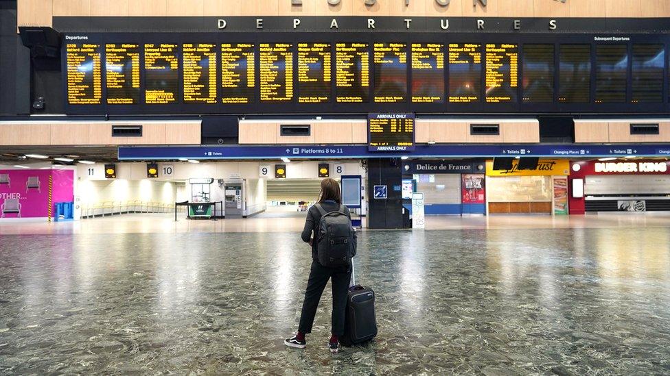 Passengers at Euston station in London, as members of the Rail, Maritime and Transport union begin their nationwide strike on 21 June 2022