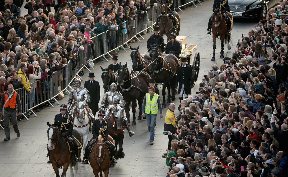 The coffin containing the remains of King Richard III carried through Leicester